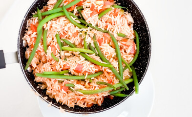 Fried Basmati Rice with Tomato Sauce, Green Beans and Red Bell Peppers in a Pan, Healthy Diet Vegetarian Meal