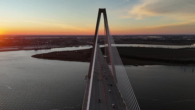 Arthur Ravenel Jr Bridge cars driving over Cooper River 4K aerial drone shot Charleston South Carolina at sunset
