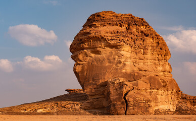 A huge monolith  looking like a man or monster near Al Ula in the desert of Saudi Arabia