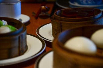 Various dim sum on the table. Yum Cha scene. Traditional and common food in Yam Cha Culture. Chinese culture and Chinese cuisine. Food and beverage concept.