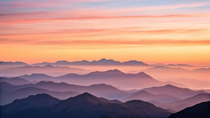 Obraz premium A breathtaking view of layered mountains under a colorful sunrise sky, showcasing the beauty of nature's gradients and soft silhouettes.