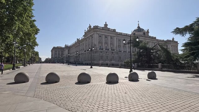 4K video of the Royal Palace of Madrid, Spain, showcasing its grand baroque architecture and historic landmark under clear daylight