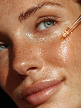 Girl doing skincare with hydrating serum close up