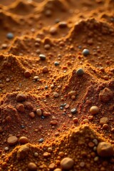 Rich brown soil, pebbles scattered across surface, barren, rough