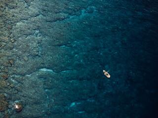 Kayaking in blue sea. Drone view