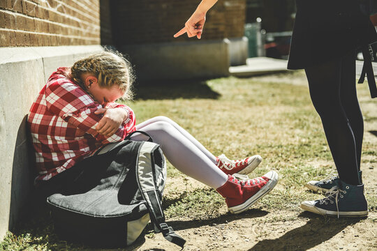 sad girl Bullying in Schoolyard with other student have some intimidation attitude - Powered by Adobe