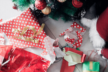 The colorful chaos of torn wrapping paper after Christmas gift opening