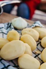 Peeled potatoes ready for slicing to make traditional Spanish omelette