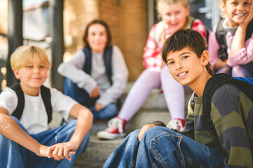Group Of Young Children Hanging Out In Playground
