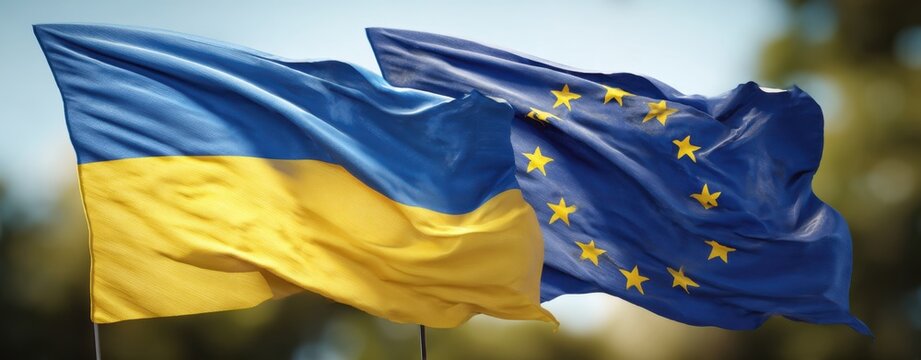 The flags of Ukraine and the European Union waving together in sunlight