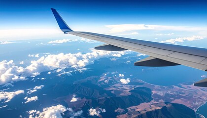 Obraz premium Airplane wing over a mountainous landscape