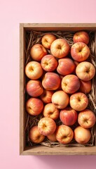 Freshly Picked Nectarines Displayed in a Rustic Wooden Crate with Natural Straw Bedding on Simple Pale Background