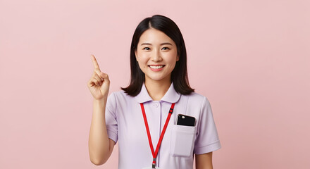 Smiling Asian woman pointing up presenting ideas solutions concept happy positive cheerful success