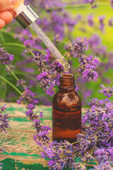 Lavender essential oil and supplements. Selective focus.