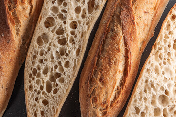 Crusty Baguette Slices On Dark Background Fresh Bakery Sourdough Bread Close-Up For Food Photography