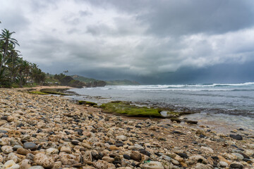 Bathsheba Beach on the rugged east coast of Barbados. Dramatic coastline of striking rock...