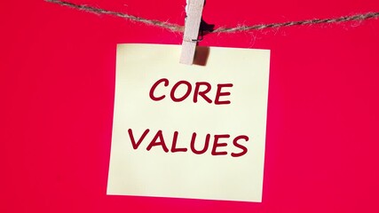 Business and our core values concept. Animation of the CORE VALUES text on a yellow sticker on a red background. - Powered by Adobe