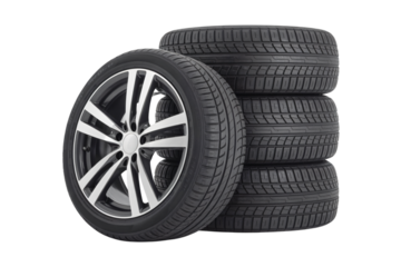 Stack of new car tires with alloy rims on a black studio background on transparent background