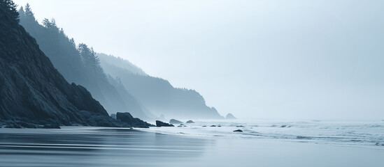 Misty coastal landscape with dark cliffs and calm ocean waves banner.