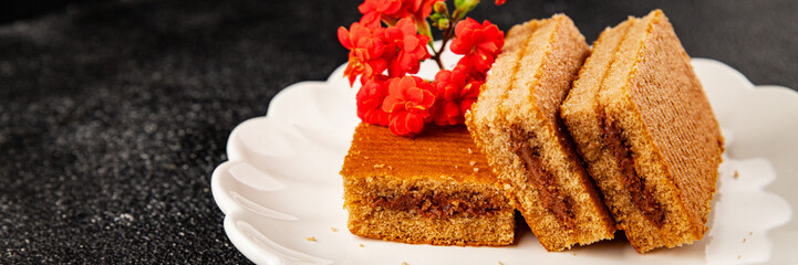 Biscuit cake portion filling jam sweet dessert cake natural product tasty snack fresh delicious gourmet food background on the table rustic top view copy space