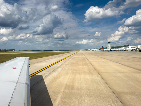 Airport runway with air traffic control tower at the Greenville Spartanburg International Airport
