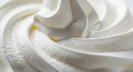 A closeup macro shot of whipped cream in swirls
