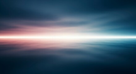 A blurred seascape shows a pink and white horizon line between dark sky and water