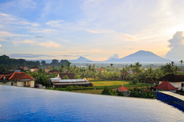 Obraz premium Beautiful view of a mountain range with a small town in the distance