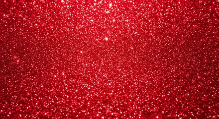 A closeup, abstract view of shimmering red glitter particles, creating a textured and sparkling background effect