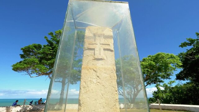 The discovery landmark of brazil is protected by a glass enclosure