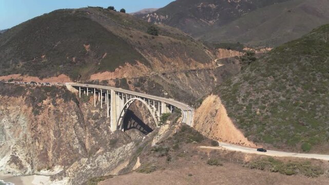 Bixby creek bridge stretches across a canyon along the california coast