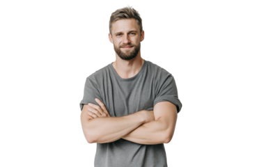 A confident bearded man with short brown hair, wearing a grey tshirt, stands with his arms crossed and looks directly at the camera, isolated on transparent background