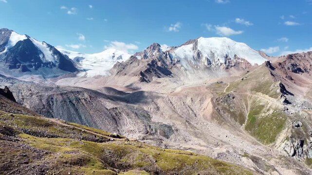Stunning 4K Aerial Drone Shot of Tuyuk-Su Glacier and Tian Shan Mountains near Almaty, Kazakhstan. Central Asia Landscape Footage from Alpingrad Base. 