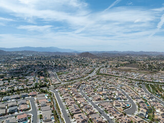 Aerial view of a sprawling neighborhood of family homes in Menifee city in Riverside County, California, United States