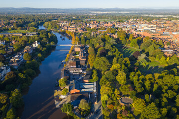 Aerial view of the River Dee and Chester Cathedral with lush green parks and historic city architecture.