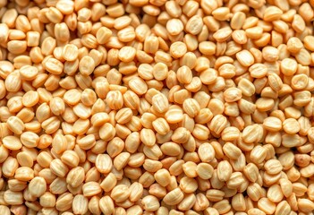 Fototapeta premium Close-up of raw buckwheat groats, showing texture and color, texture background, food texture