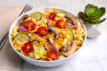 macaroni salad with tomatoes and mushrooms