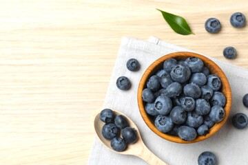 Bowl with fresh blueberries on the table