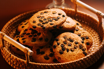 Delicious baked cookies arranged in a woven basket for afternoon enjoyment