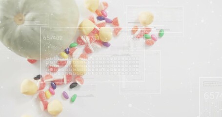 Digital overlays fading in over melon with candy, cycling numbers and sliding keys visualizing data - Powered by Adobe