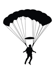 Silhouette of a skydiver descending under a parachute