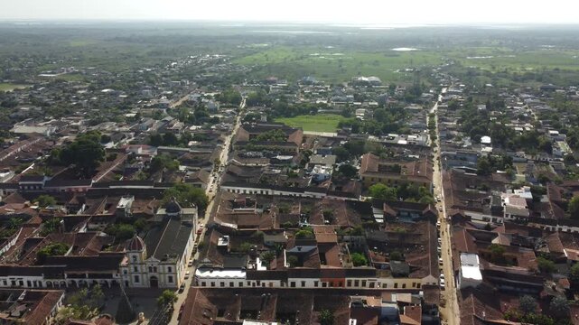 Aerial view of the historic city of Santa Cruz de Mompox in sunlight with the river and the Iglesia de Santa B&aacute;rbara (Church of San B&aacute;rbara) Colombia, a World Heritage Site