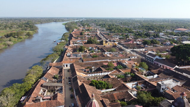Aerial view of the historic city of Santa Cruz de Mompox in sunlight with the river and the Iglesia de Santa B&aacute;rbara (Church of San B&aacute;rbara) Colombia, a World Heritage Site