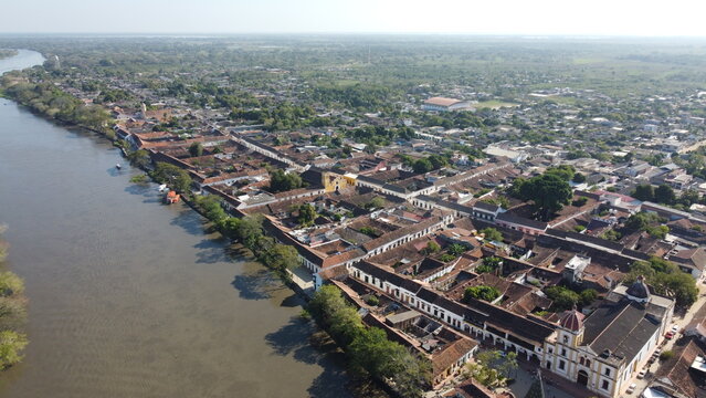 Aerial view of the historic city of Santa Cruz de Mompox in sunlight with the river and the Iglesia de Santa B&aacute;rbara (Church of San B&aacute;rbara) Colombia, a World Heritage Site