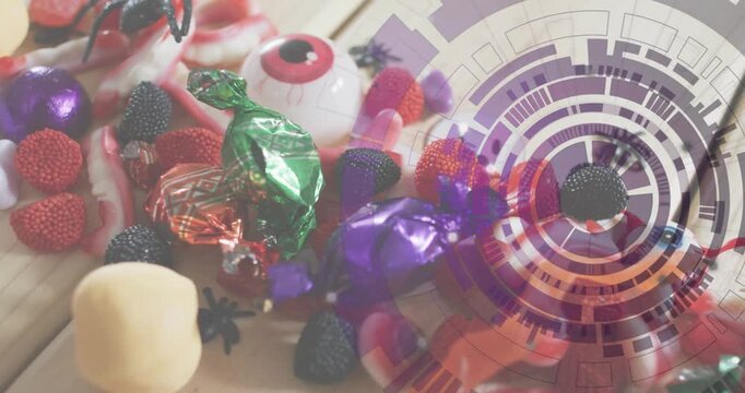 Camera starting pan revealing Halloween candy cluster while digital overlay scanning treat details