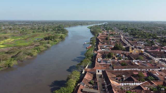Aerial view of the historic city of Santa Cruz de Mompox in sunlight with the river and the Iglesia de Santa B&aacute;rbara (Church of San B&aacute;rbara) Colombia, a World Heritage Site