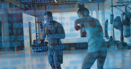Instructor guiding client doing boxing drills in studio with binary code overlay for better form - Powered by Adobe