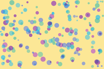 Soft pastel colored circles scattered on a pale yellow background abstract
