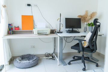 Modern and organized home office setup with printer and computer