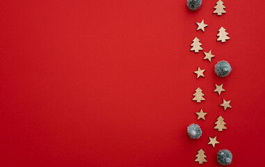 Red Christmas background for a postcard: Santa Claus, fir tree and wooden stars